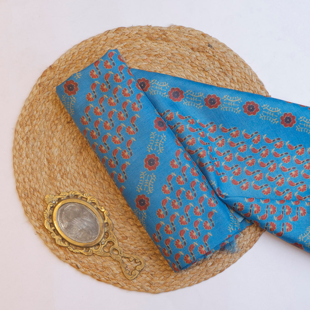 Maya Blue Tussar Fabric With Printed Floral Patterns