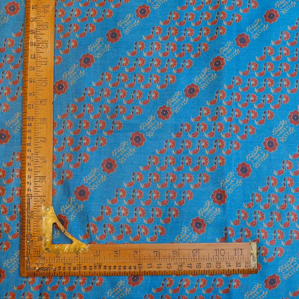 Maya Blue Tussar Fabric With Printed Floral Patterns