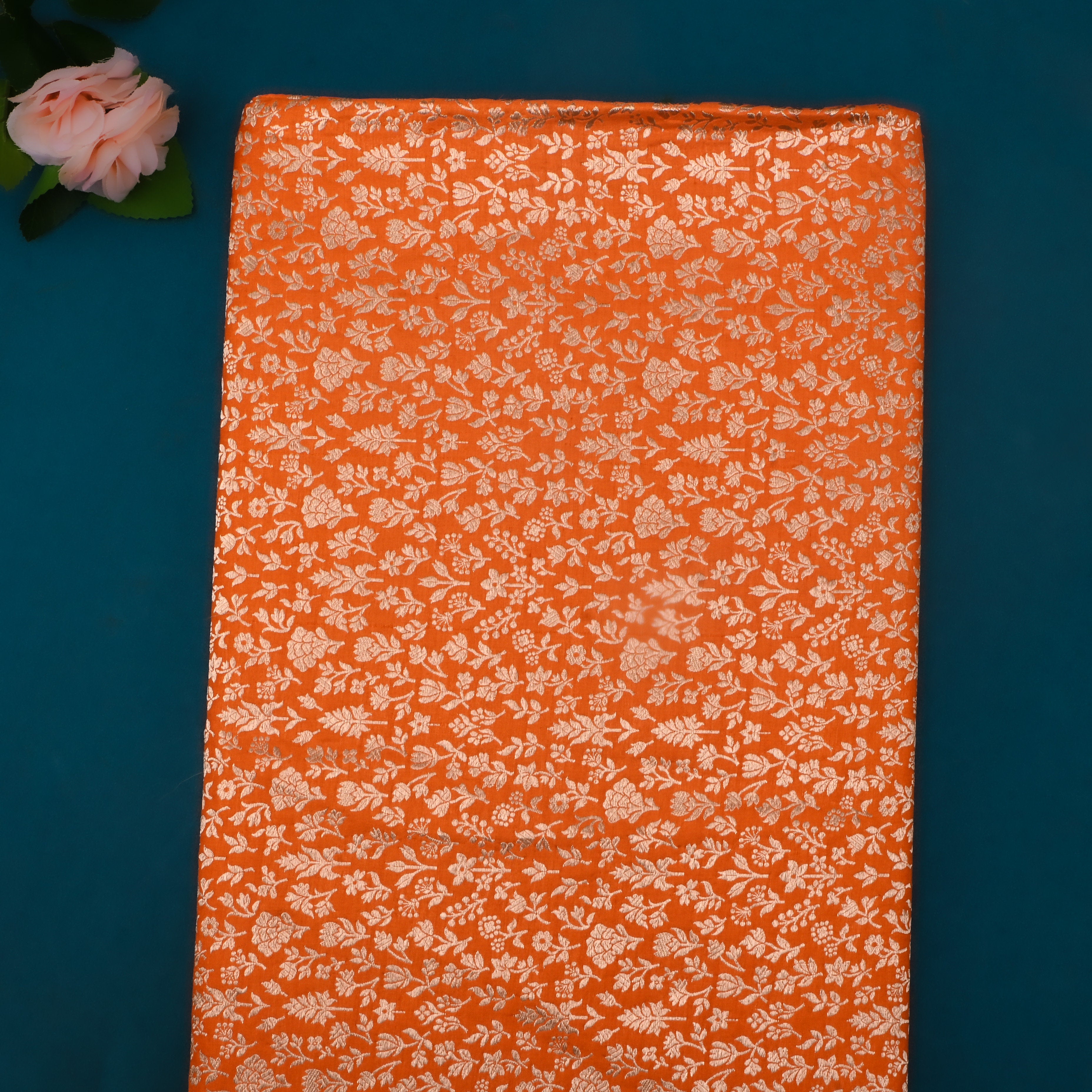 Bright Orange Jamawar Silk Fabric With Floral And Leaf Design